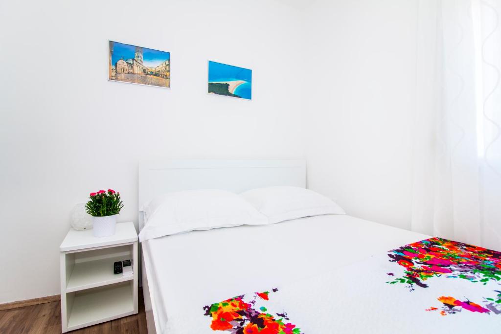 Posteľ alebo postele v izbe v ubytovaní Apartman Nella