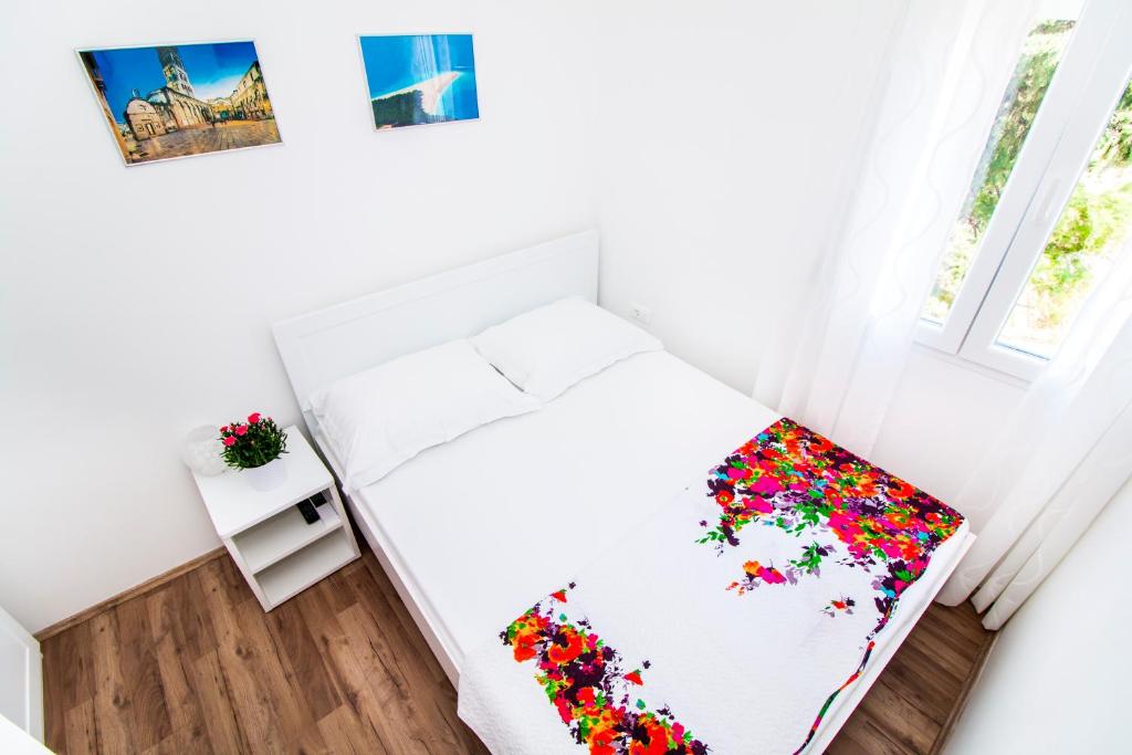 Posteľ alebo postele v izbe v ubytovaní Apartman Nella