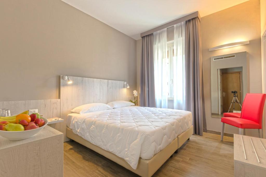 Postel nebo postele na pokoji v ubytování Hotel Terme di Frasassi