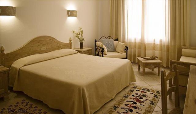 Postel nebo postele na pokoji v ubytování Hotel Libyssonis