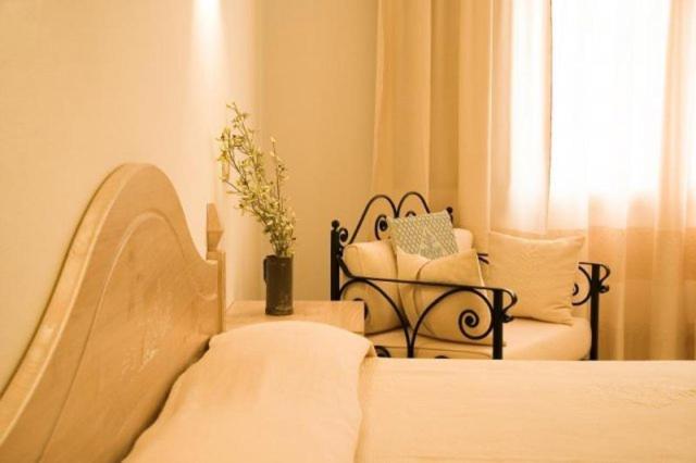 Postel nebo postele na pokoji v ubytování Hotel Libyssonis