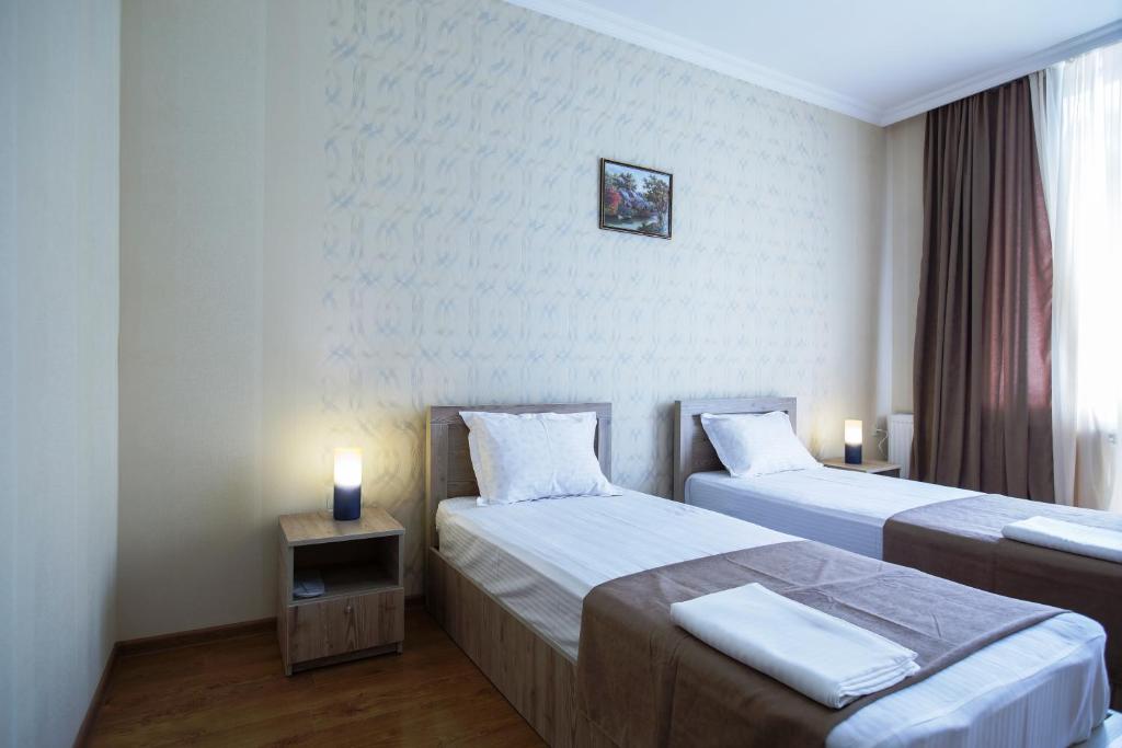Voodi või voodid majutusasutuse Hotel Old Borjomi toas