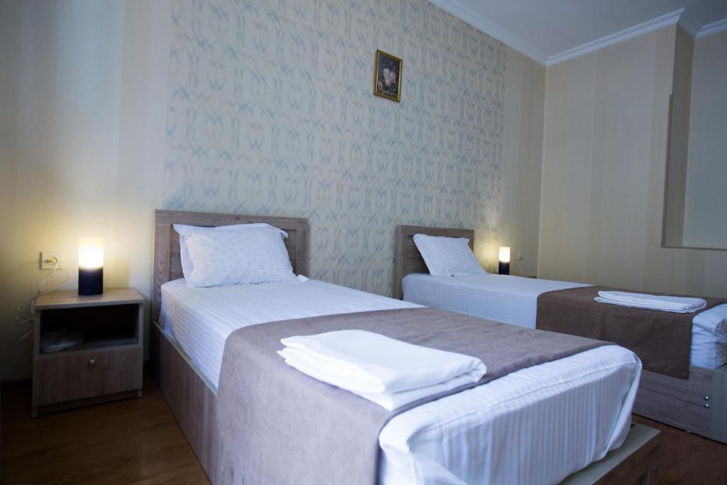 Voodi või voodid majutusasutuse Hotel Old Borjomi toas