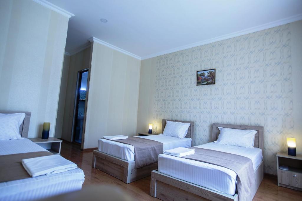 Voodi või voodid majutusasutuse Hotel Old Borjomi toas