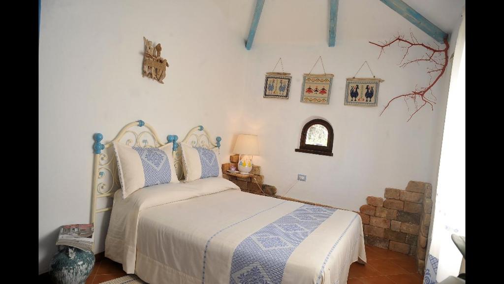 Postel nebo postele na pokoji v ubytování Rooms Romangia
