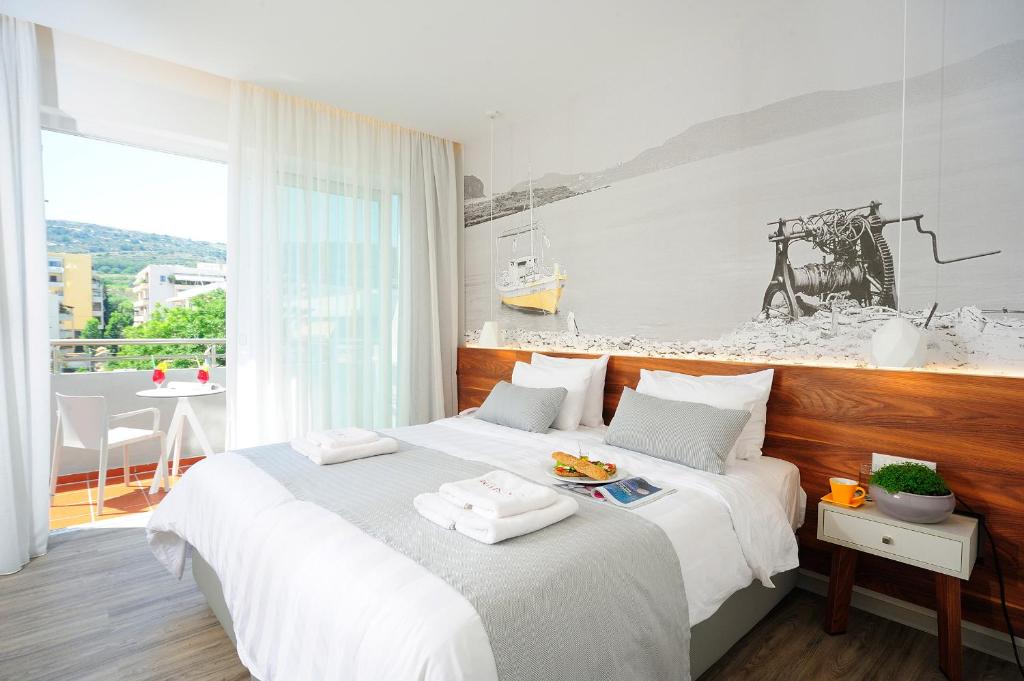 Postel nebo postele na pokoji v ubytování Atrium Ambiance Hotel