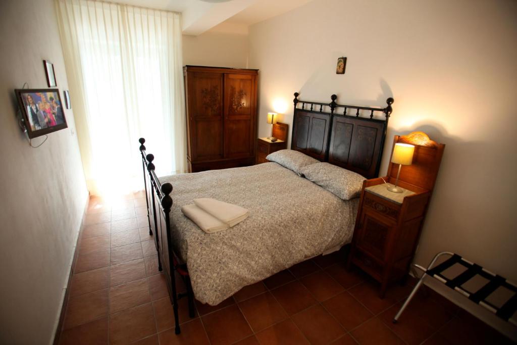 Posteľ alebo postele v izbe v ubytovaní Casale Poggio del Tiglio