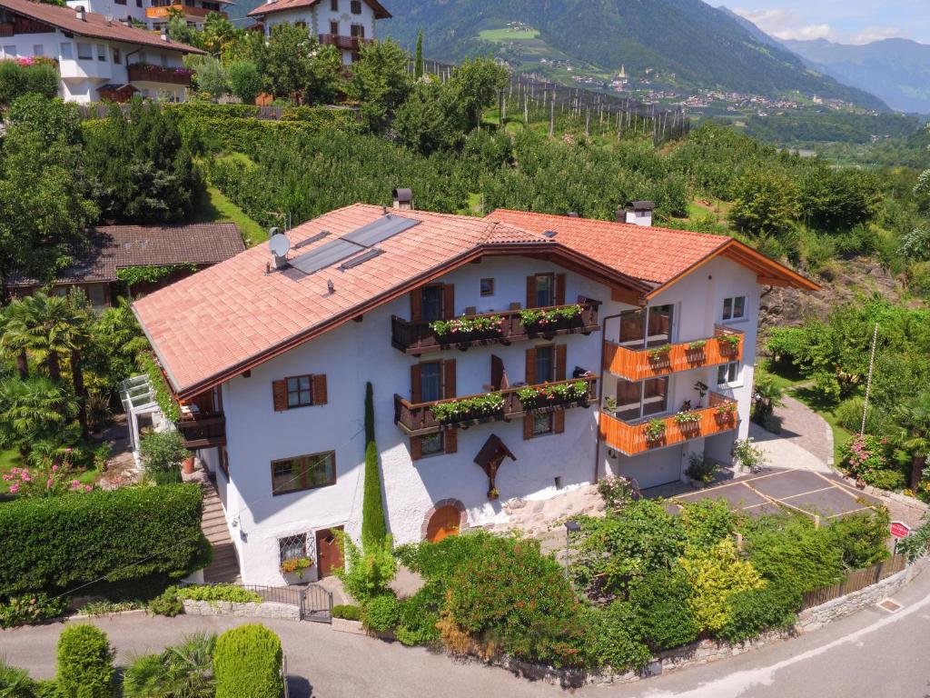 an aerial view of a white house with a red roof at Haus Zenoburg in Tirolo