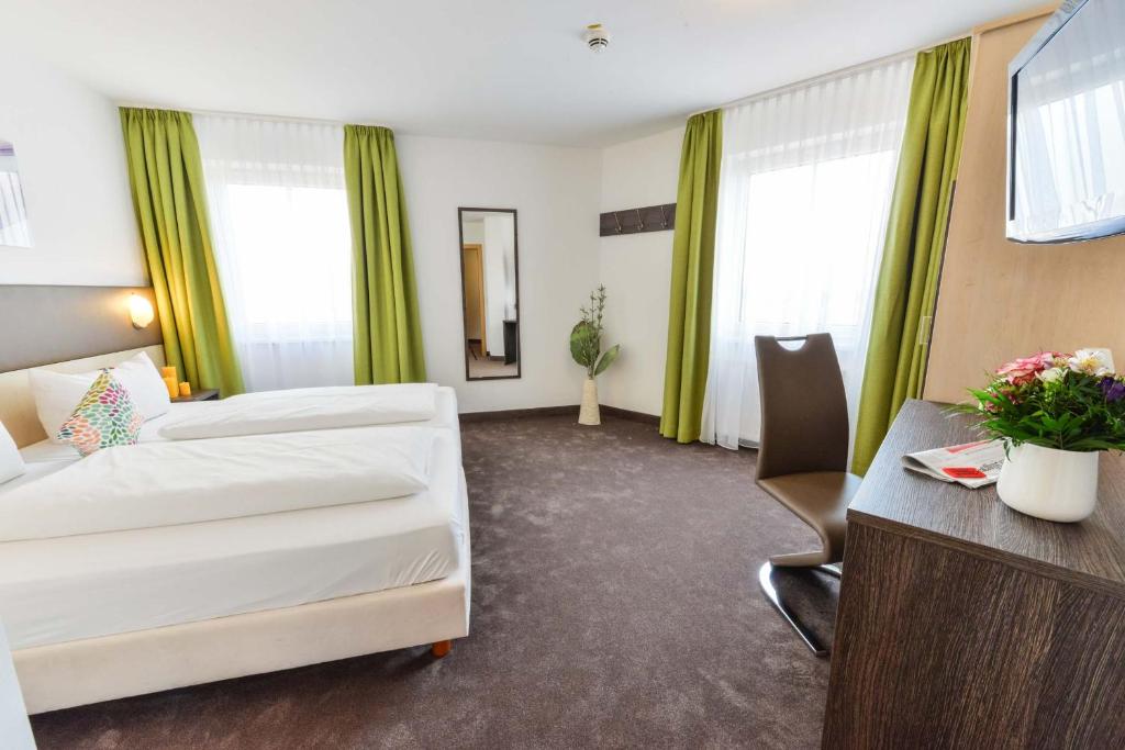 Postel nebo postele na pokoji v ubytování Hotel Günter