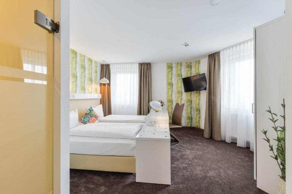 Postel nebo postele na pokoji v ubytování Hotel Günter