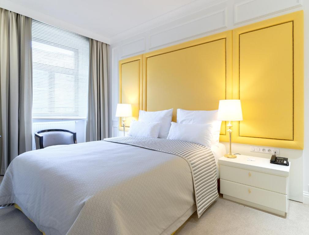 Postel nebo postele na pokoji v ubytování Boutique Hotel Corso