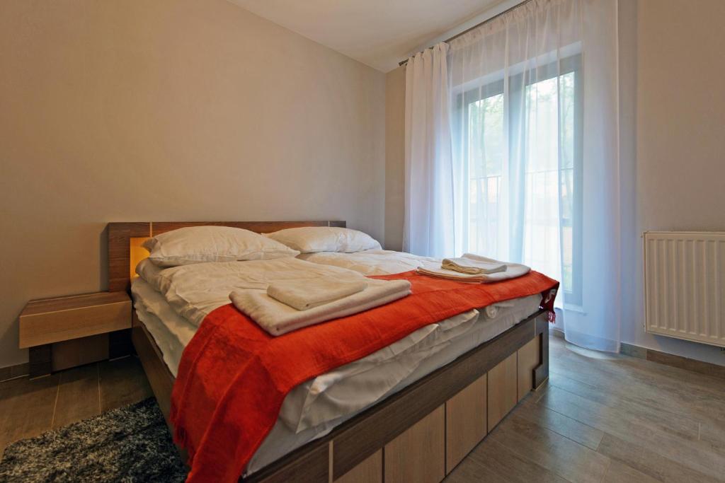 Posteľ alebo postele v izbe v ubytovaní Apartamenty Sun & Snow Resort Sudety