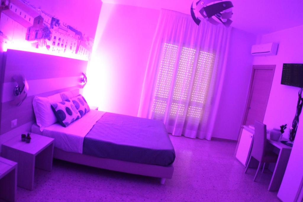 Postel nebo postele na pokoji v ubytování A'MANTIA HOTEL