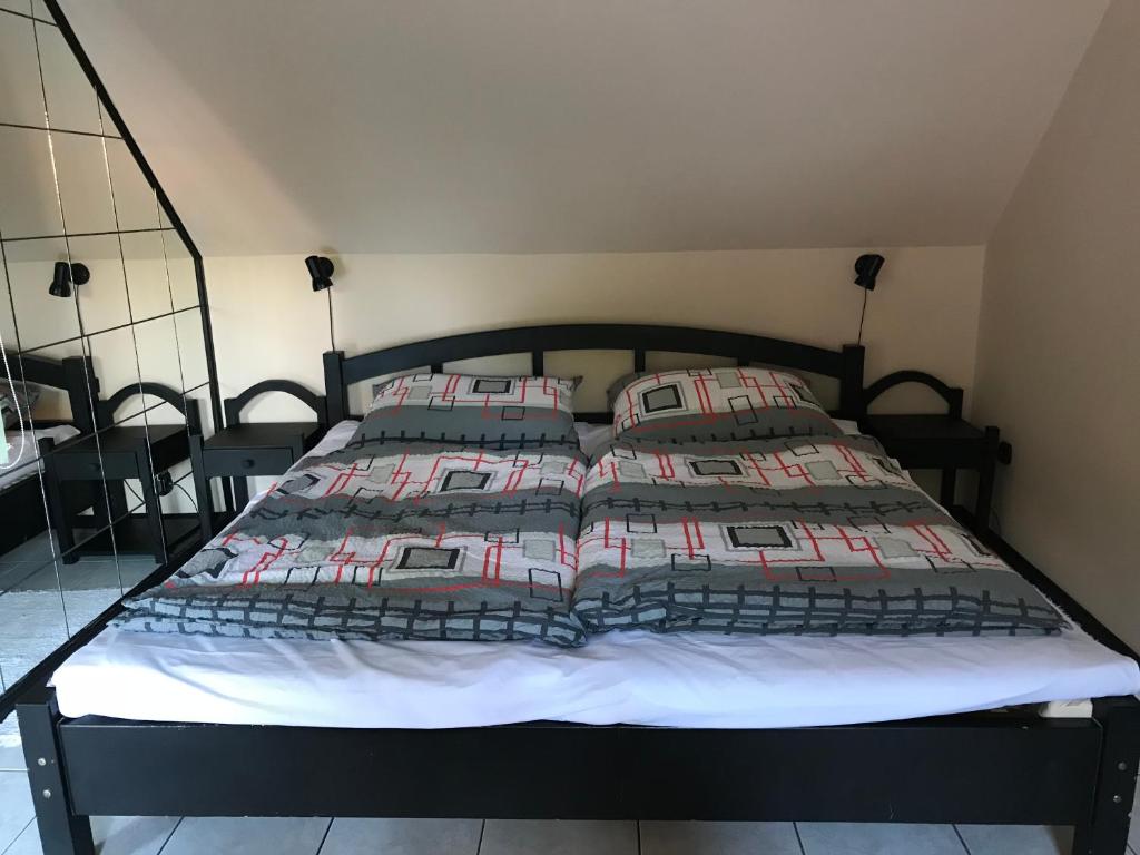 Postel nebo postele na pokoji v ubytování Óvár 12 Vendégház