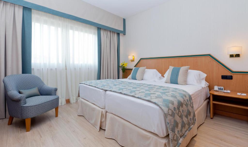 Uma cama ou camas num quarto em Hotel Praga