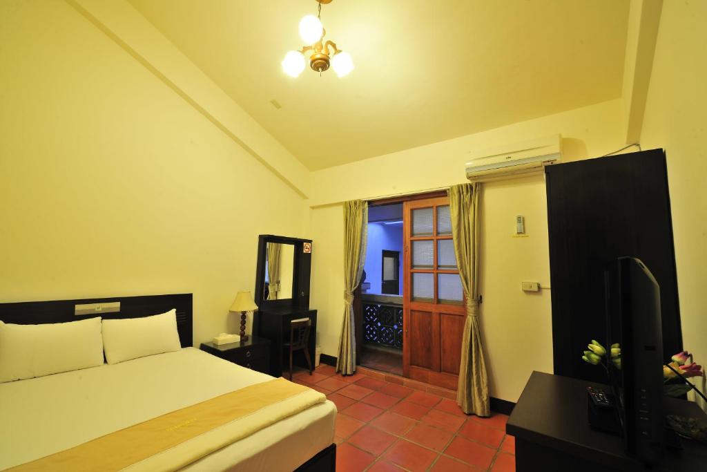 Postel nebo postele na pokoji v ubytování Makung Traditional Homestay