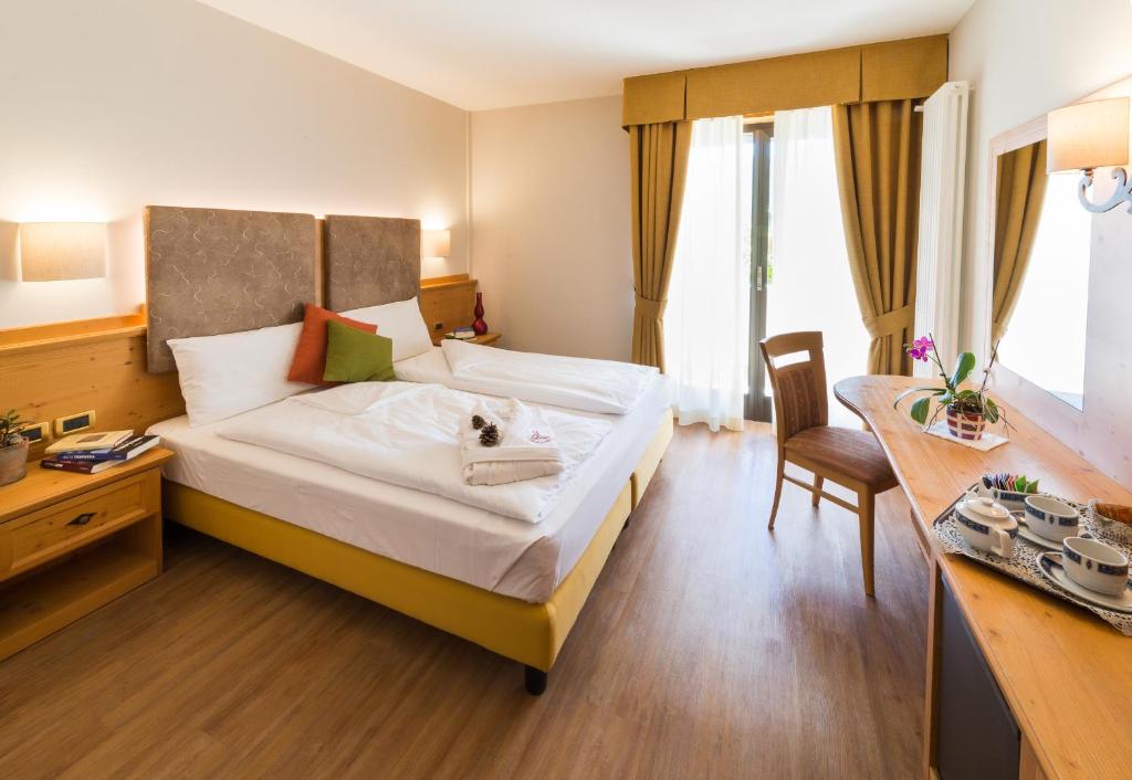 Postel nebo postele na pokoji v ubytování Hotel Ambassador