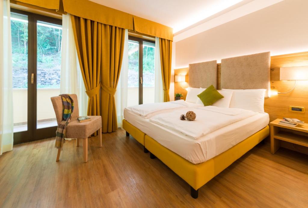 Postel nebo postele na pokoji v ubytování Hotel Ambassador