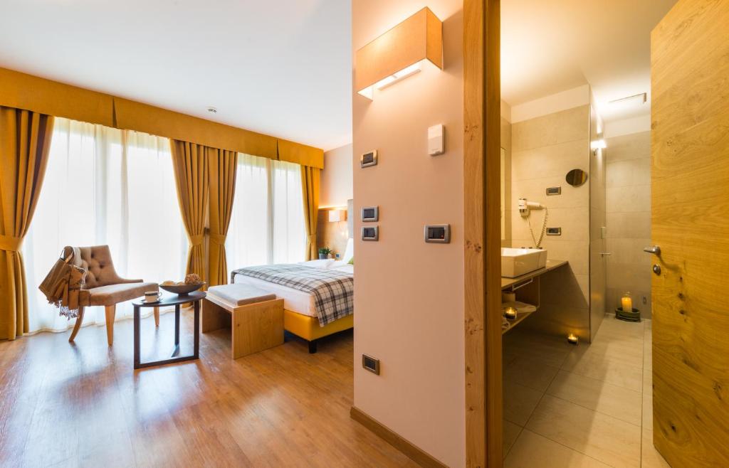 Postel nebo postele na pokoji v ubytování Hotel Ambassador