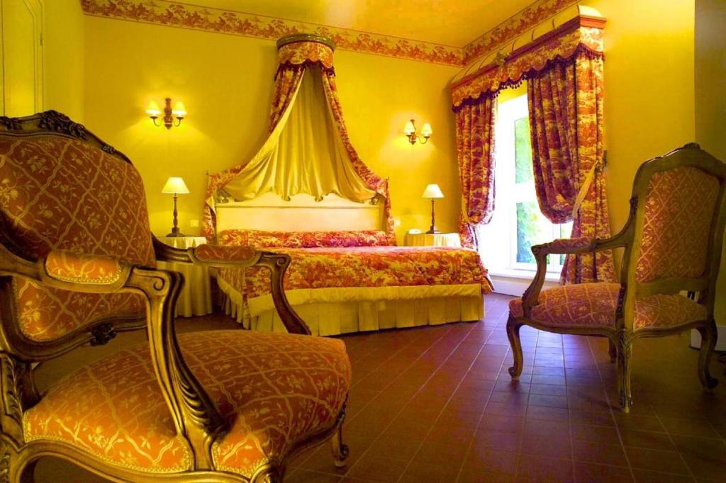 Postel nebo postele na pokoji v ubytování Hôtel Château de Cavanac