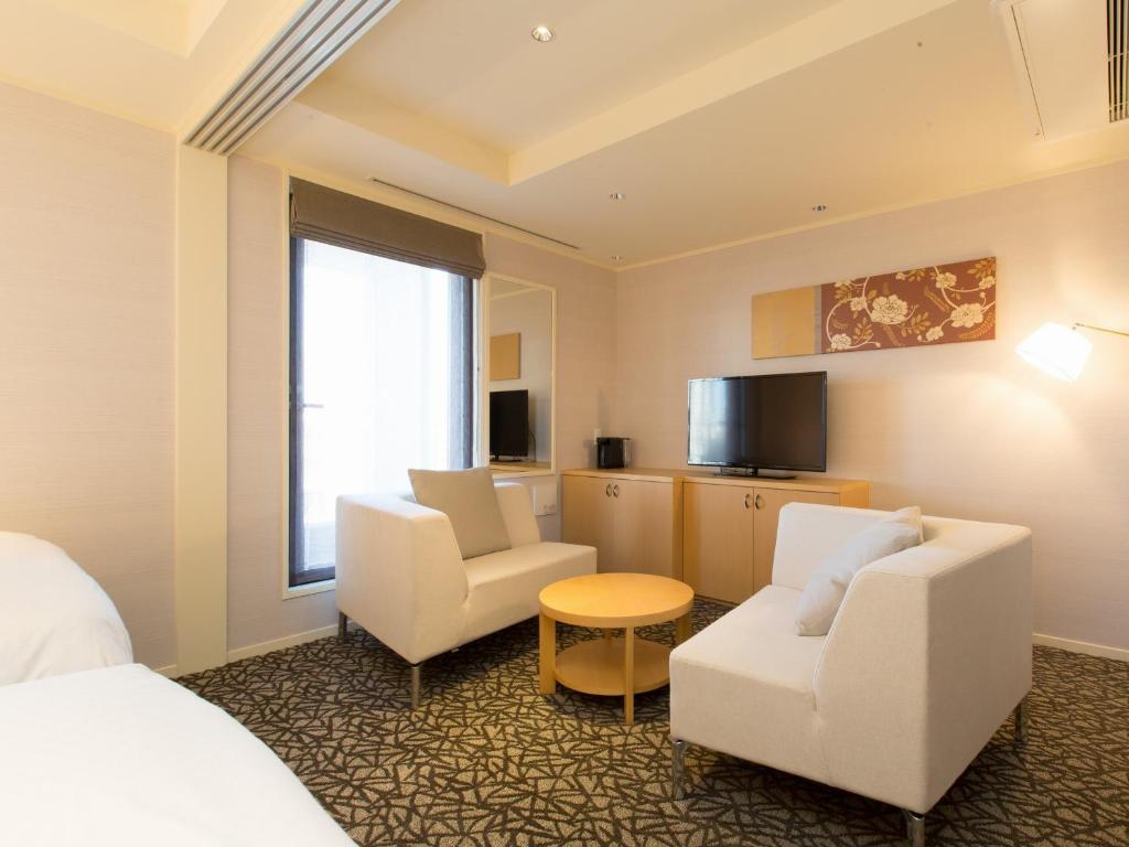 TV a/nebo společenská místnost v ubytování Hotel Shiki Utsubo Park