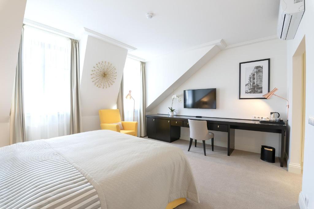 Postel nebo postele na pokoji v ubytování Boutique Hotel Corso