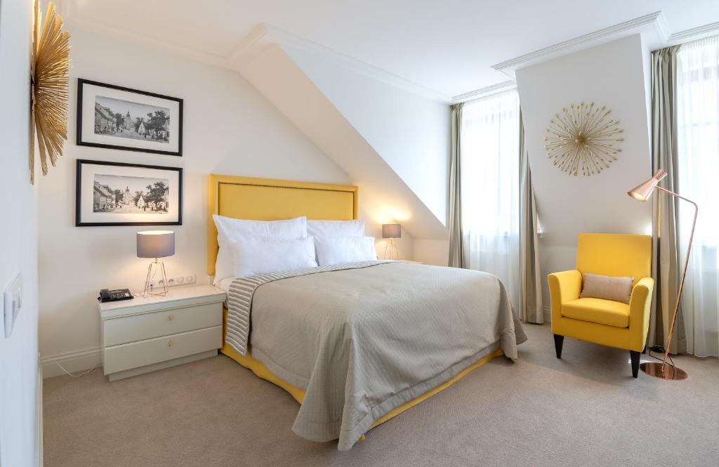 Postel nebo postele na pokoji v ubytování Boutique Hotel Corso
