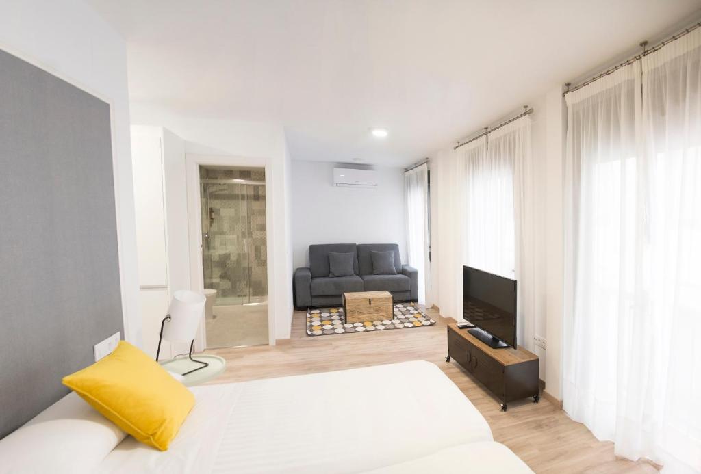 TV a/nebo společenská místnost v ubytování Apartamentos Core Suite Sevilla