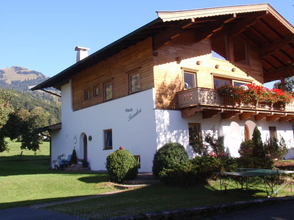 a large white house with a balcony at Haus Sandra in Kitzbühel