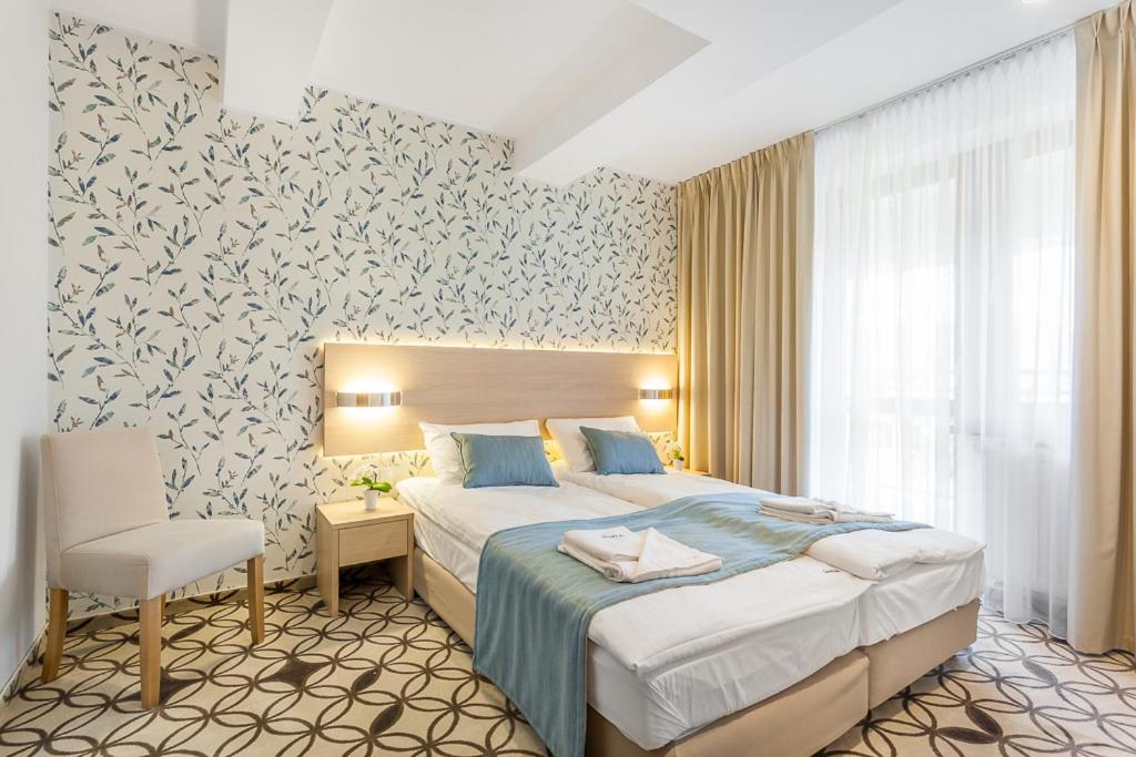 Postel nebo postele na pokoji v ubytování Grand Łeba - Adults Only (13+)