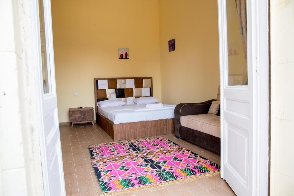Postel nebo postele na pokoji v ubytování New Grand Royal Hotel Cairo