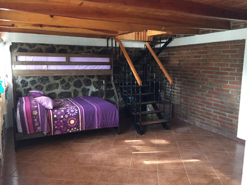 Postel nebo postele na pokoji v ubytování Rincón del Bosque