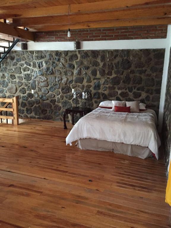 Postel nebo postele na pokoji v ubytování Rincón del Bosque