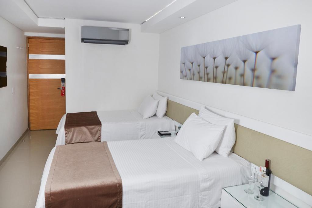 Postel nebo postele na pokoji v ubytování Hotel Zona A