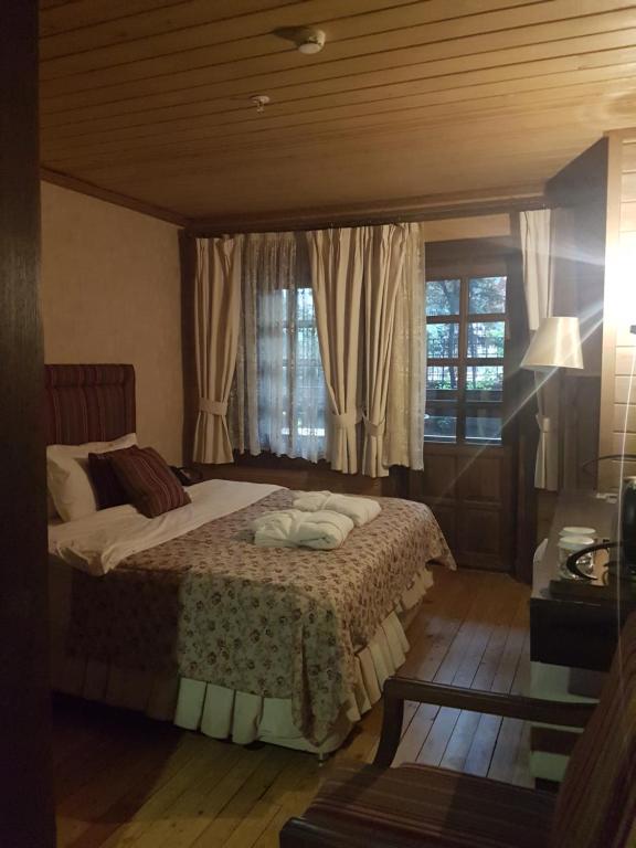 Кровать или кровати в номере Royal Uzungol Hotel&Spa