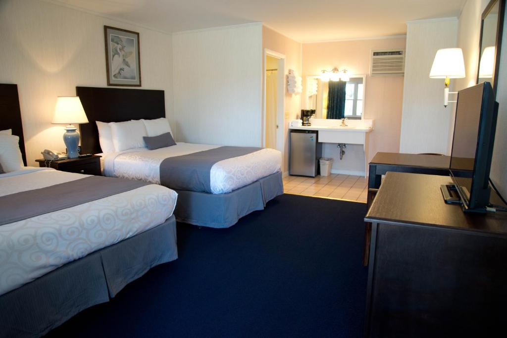 Postel nebo postele na pokoji v ubytování Sea Shell Motel