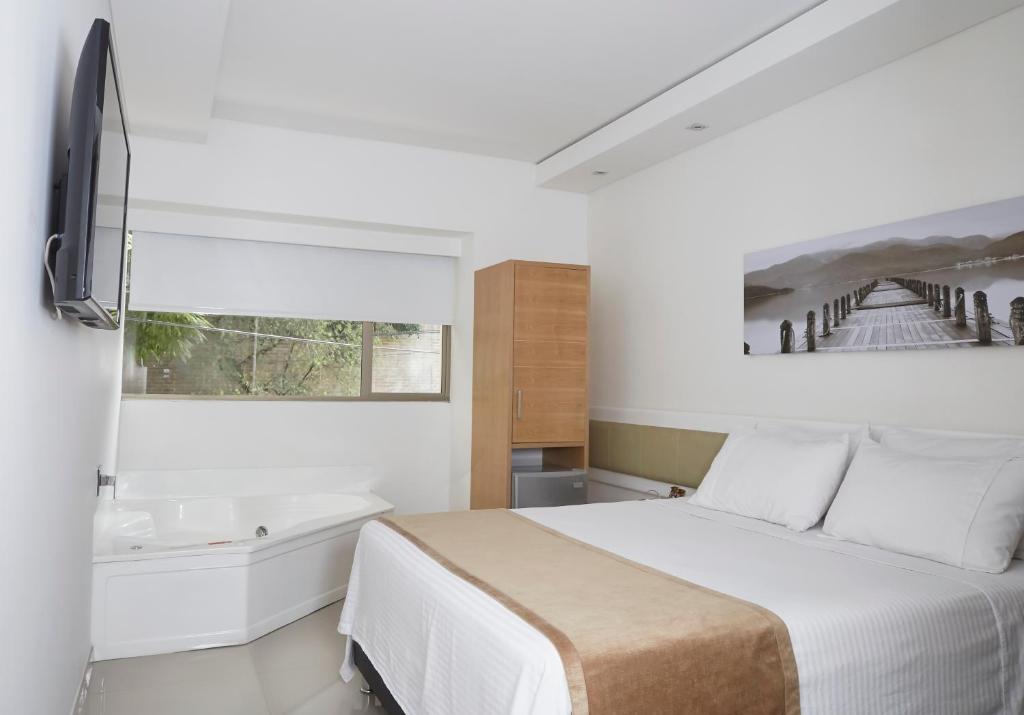 Postel nebo postele na pokoji v ubytování Hotel Zona A