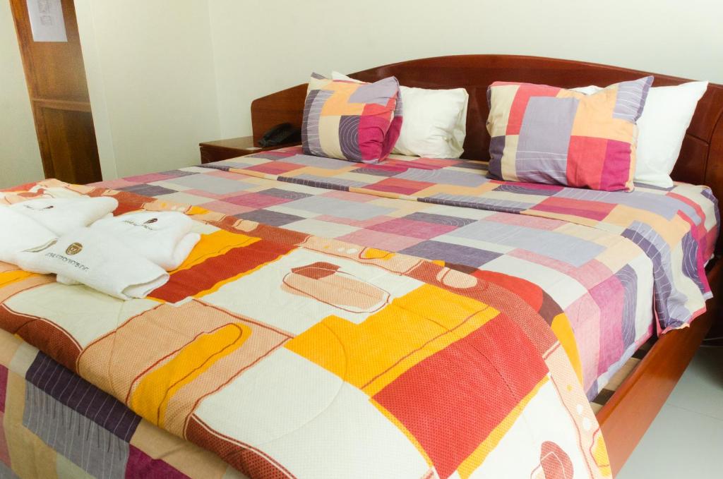 Postelja oz. postelje v sobi nastanitve Hotel Jose Antonios Inn