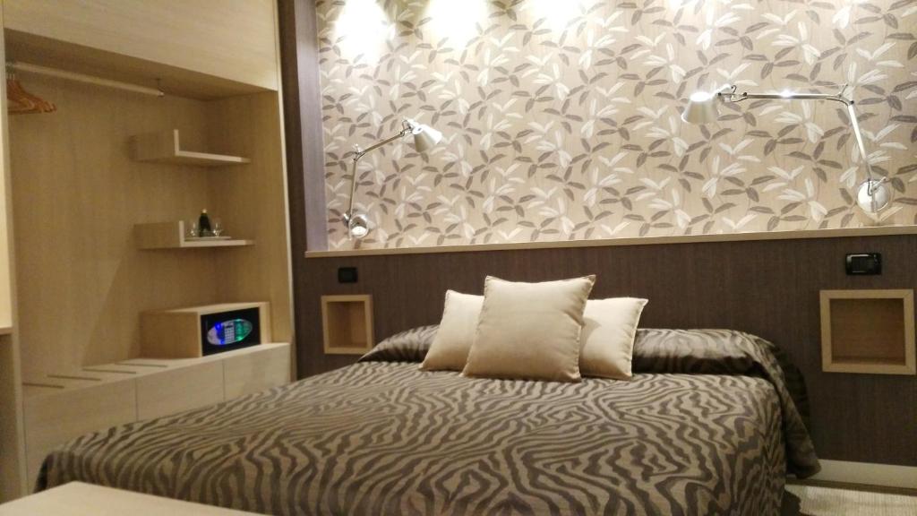 Postel nebo postele na pokoji v ubytování Albergo Suisse Bellevue