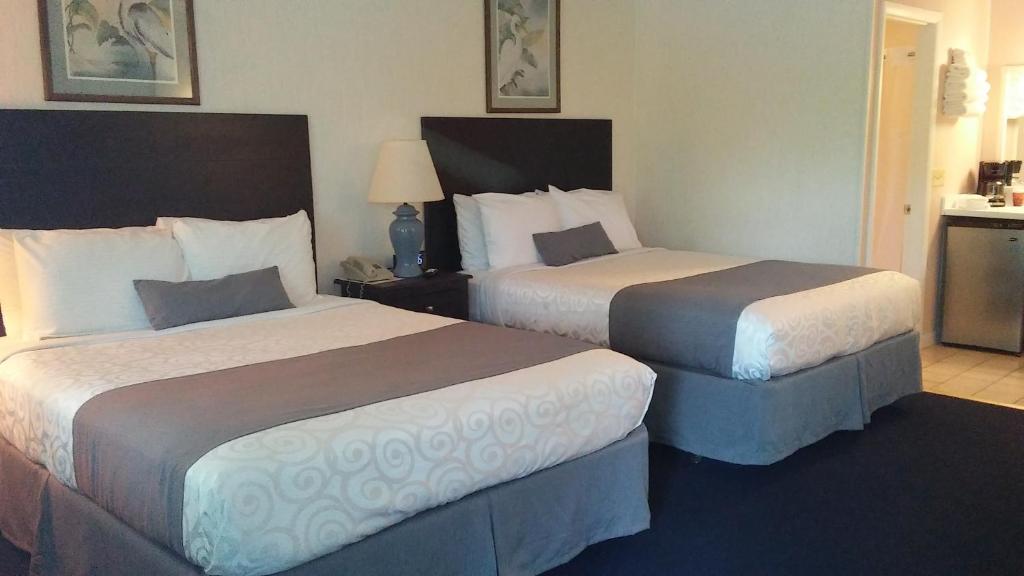 Postel nebo postele na pokoji v ubytování Sea Shell Motel