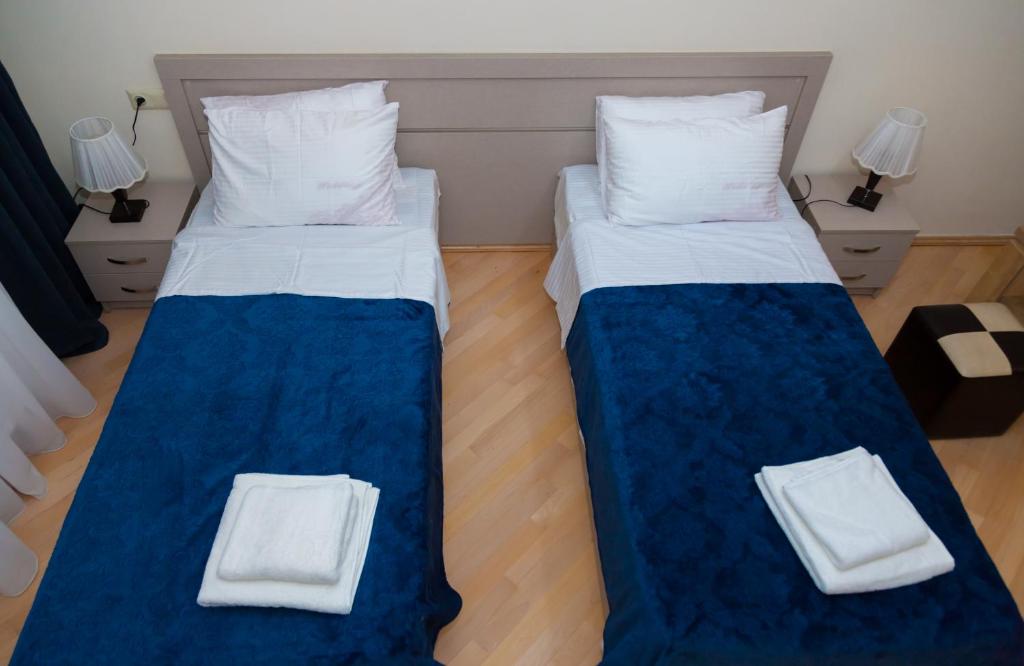 Postel nebo postele na pokoji v ubytování Holiday Rooms