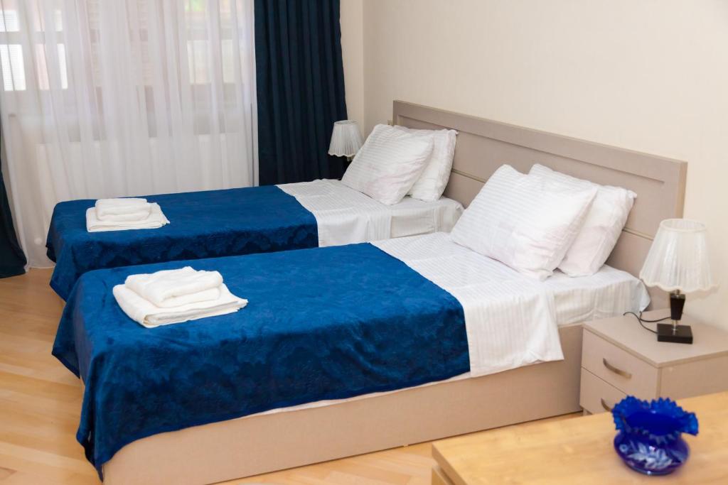 Postel nebo postele na pokoji v ubytování Holiday Rooms