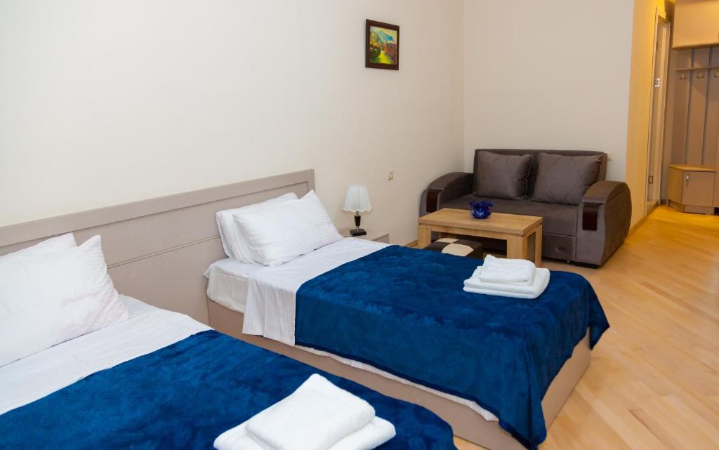 Postel nebo postele na pokoji v ubytování Holiday Rooms