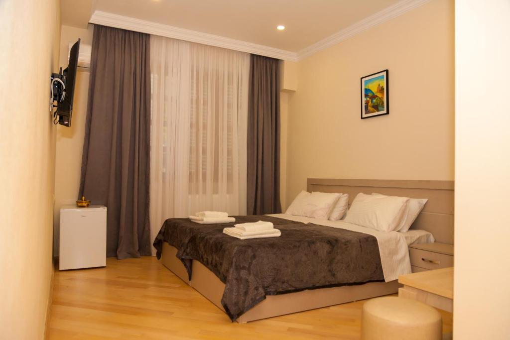 Postel nebo postele na pokoji v ubytování Holiday Rooms
