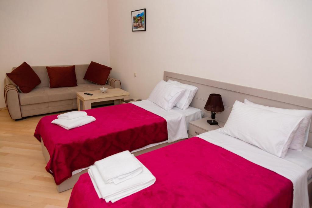 Postel nebo postele na pokoji v ubytování Holiday Rooms