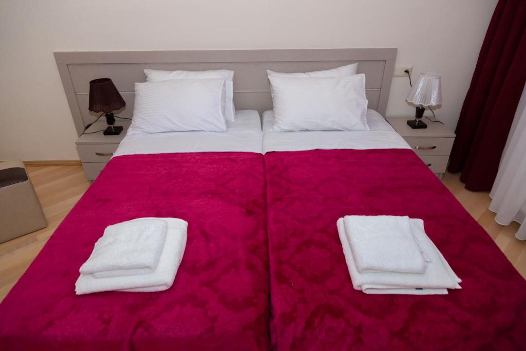 Postel nebo postele na pokoji v ubytování Holiday Rooms