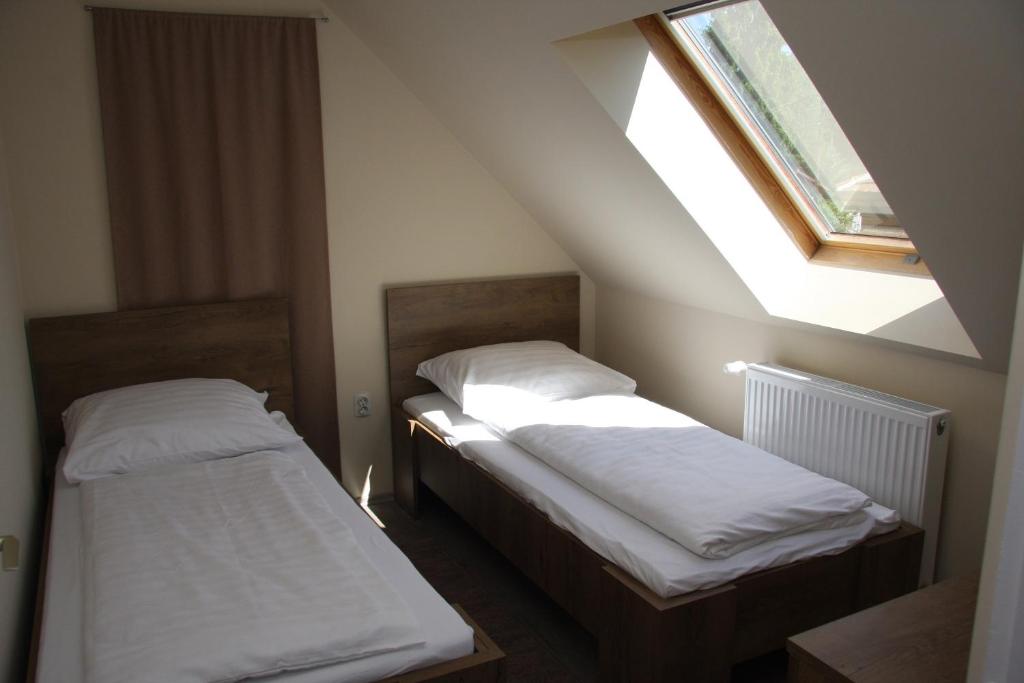 Postel nebo postele na pokoji v ubytování Villa Maria Apartman