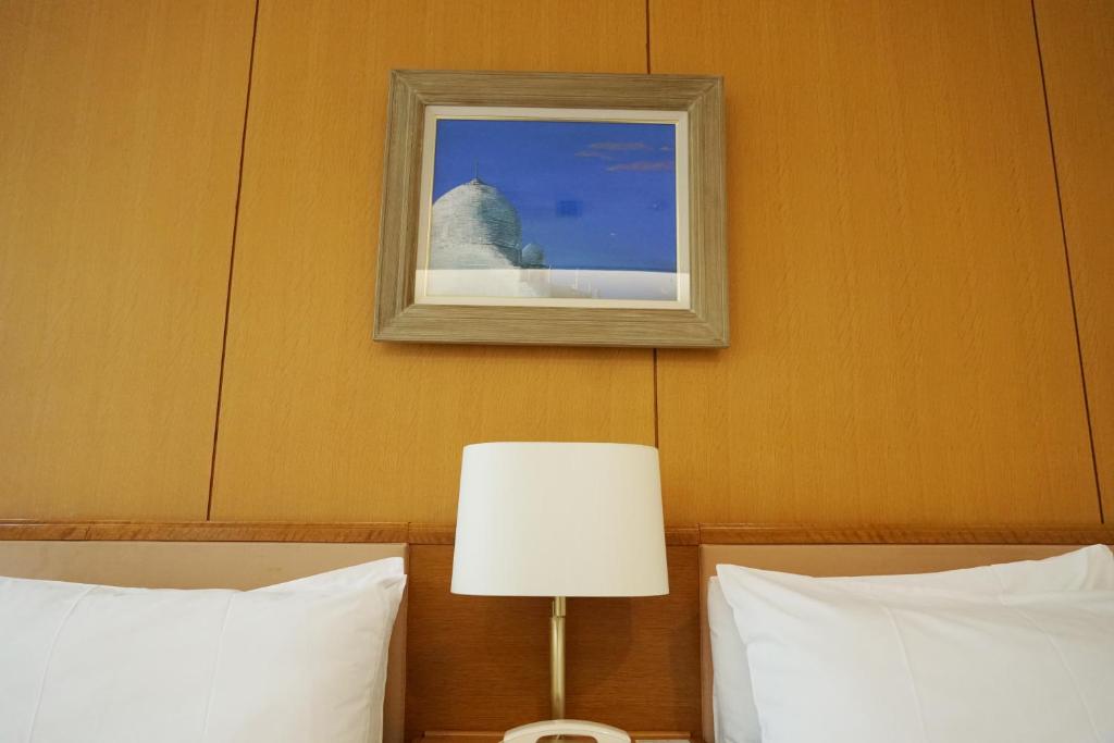 Postel nebo postele na pokoji v ubytování Blancvert Nasu Onsen Hotel