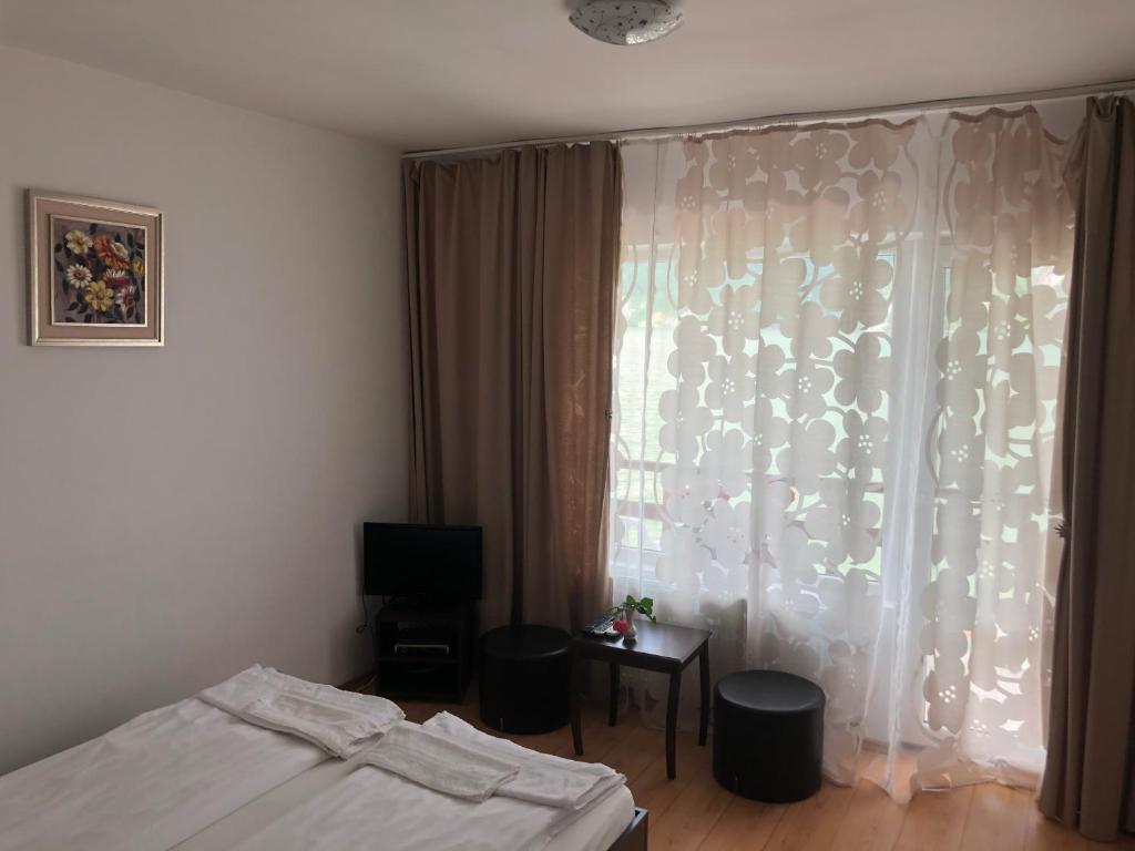 Postel nebo postele na pokoji v ubytování Casa Adrian