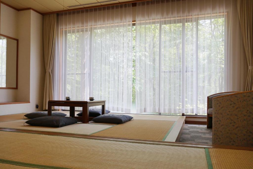Postel nebo postele na pokoji v ubytování Blancvert Nasu Onsen Hotel